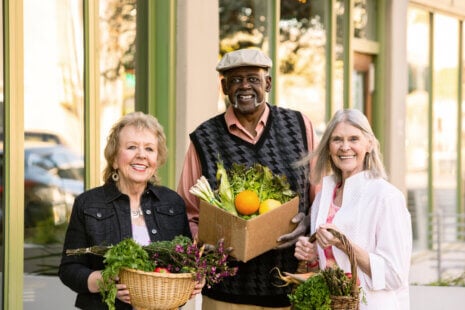Seniors selecting colorful spring produce at a farmer’s market