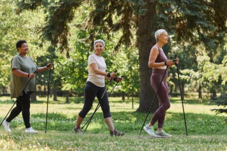 Elderly women walking in shaded park