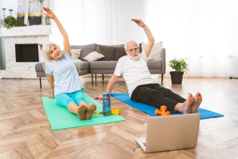 A senior couple enjoying yoga, demonstrating the benefits of exercise for seniors.